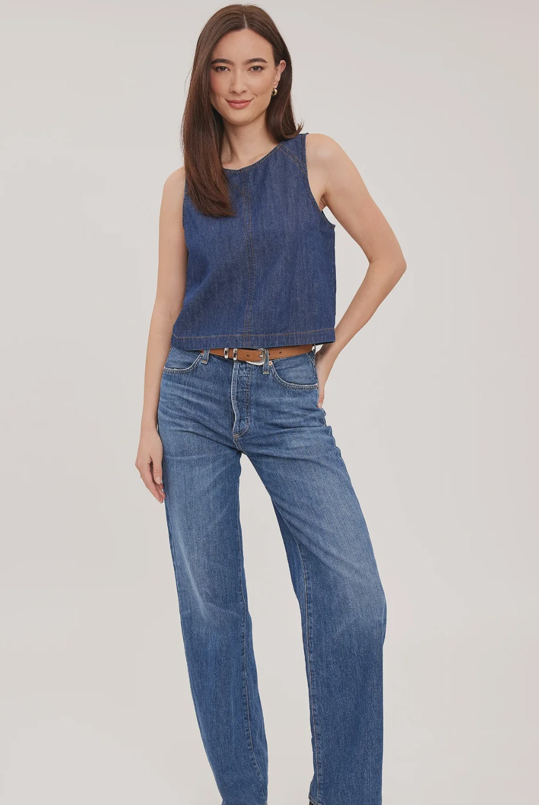 Blaise denim tank top in washed denim with contrast topstitching details and a back keyhole closure, designed for a relaxed, lived-in look.