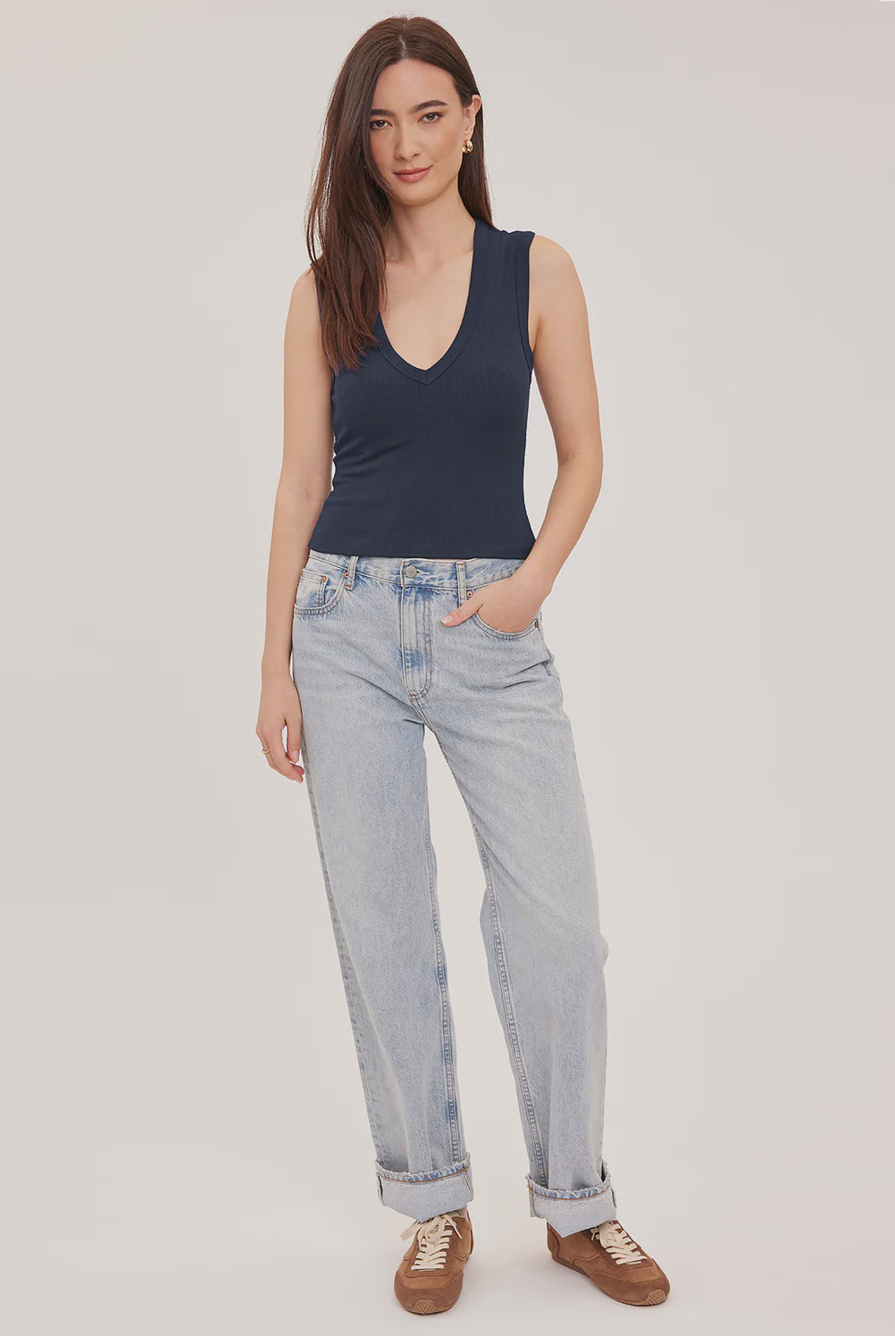 Women's navy blue ribbed cropped tank top featuring a V-neckline, wide straps, and a fitted cropped silhouette in a comfortable stretch ribbed knit.