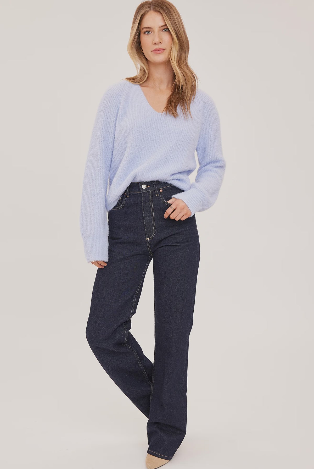 Filomena sweater in a soft, plush knit with a relaxed silhouette, flattering V-neckline, and raglan sleeves for an easy, laid-back fit. Available in Smoke and Skyline.