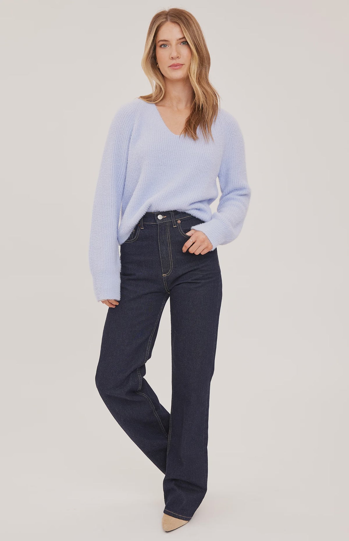Filomena sweater in a soft, plush knit with a relaxed silhouette, flattering V-neckline, and raglan sleeves for an easy, laid-back fit. Available in Smoke and Skyline.