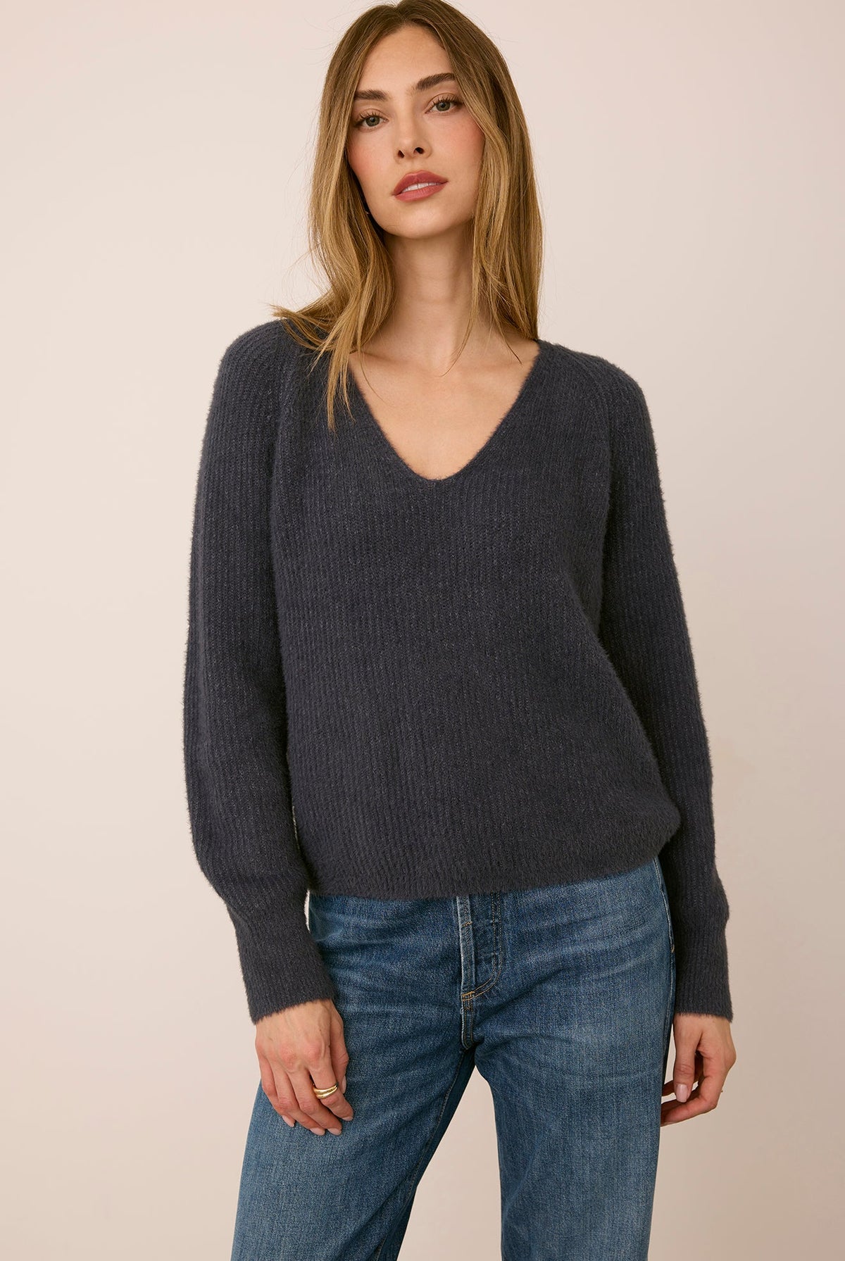 Filomena sweater in a soft, plush knit with a relaxed silhouette, flattering V-neckline, and raglan sleeves for an easy, laid-back fit. Available in Smoke and Skyline.