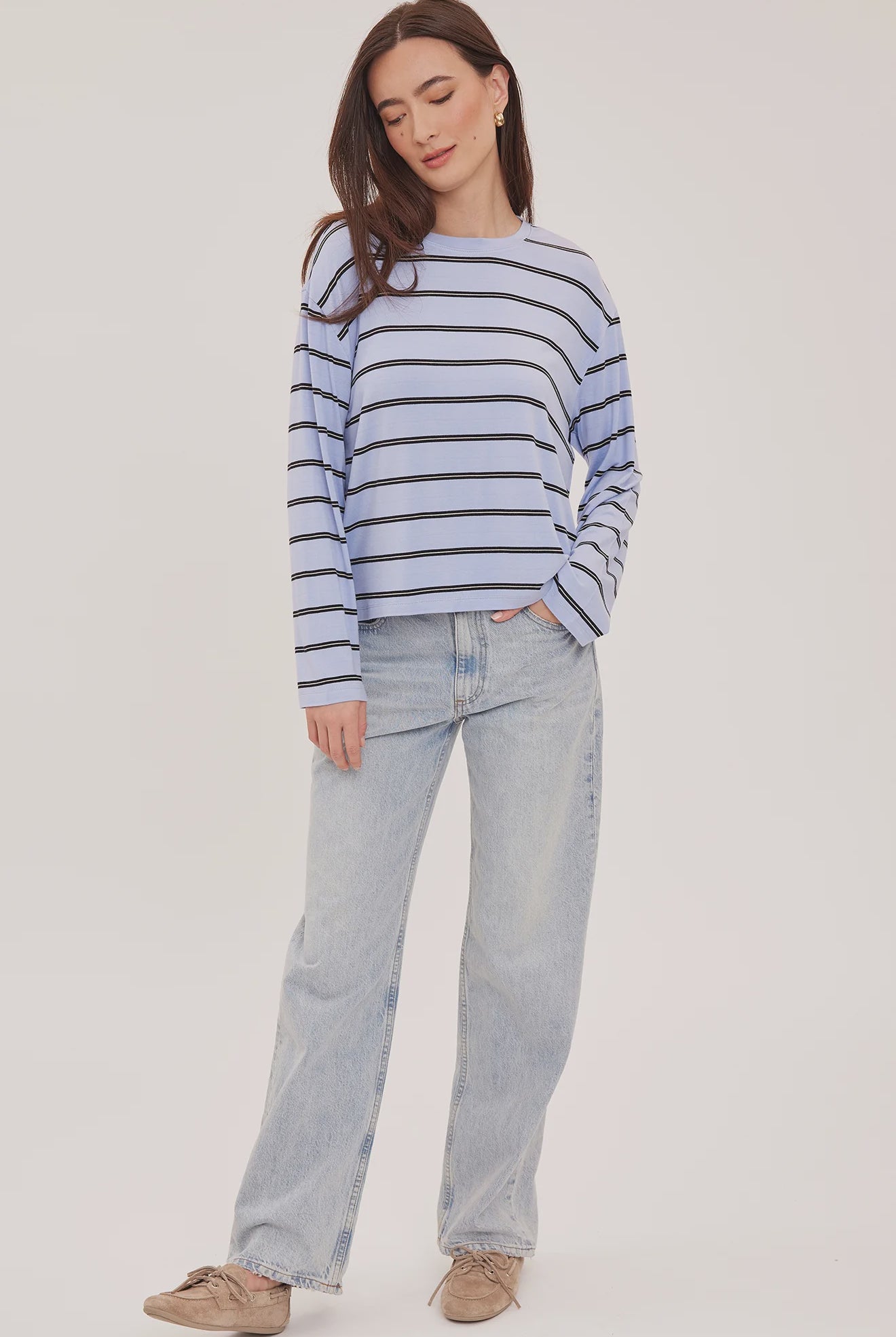Women's relaxed long sleeve top with sky blue and white stripes, a crew neckline, side slits, and a soft rayon jersey fabric