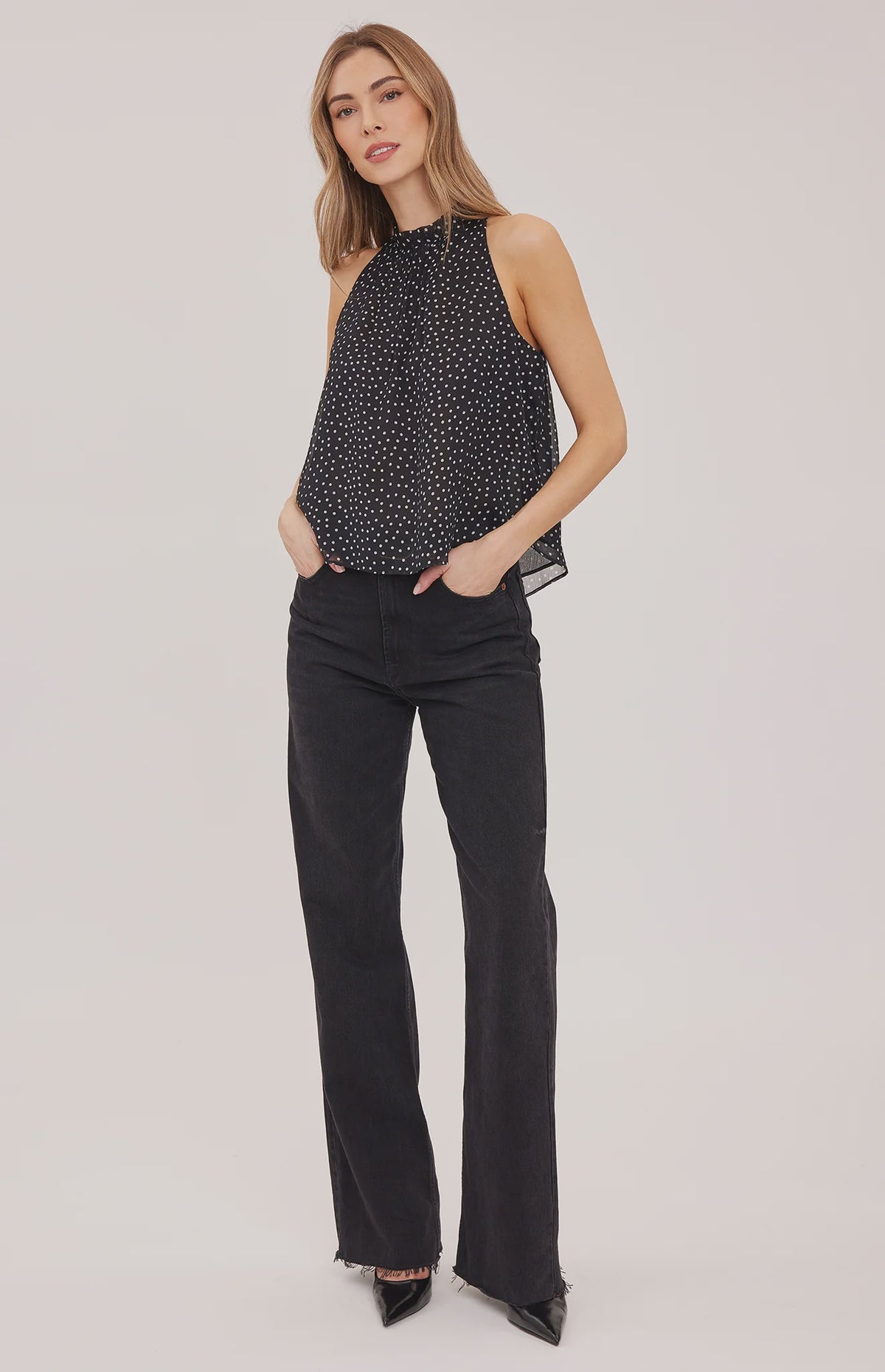 Lenora blouse in crinkled chiffon with a mock neckline, long sleeves, and a feminine back tie detail. Fully lined for comfortable wear and available in Black Print and Cream Print.