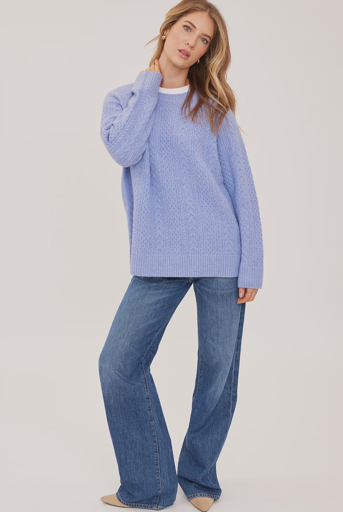 Lori sweater in a cozy heathered knit with a classic crew neckline, oversized fit, and allover cable knit detailing for a textured finish.
