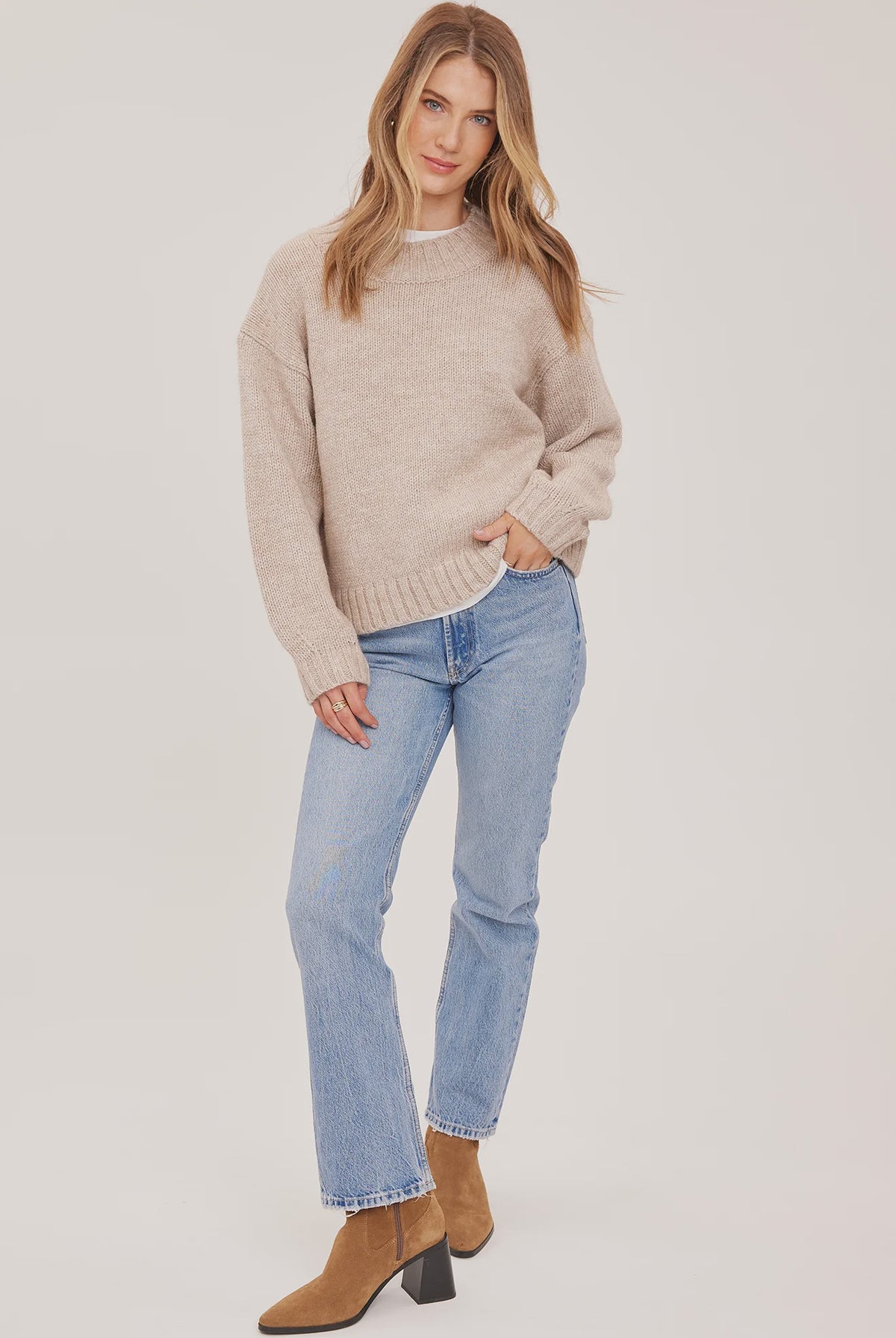 Tova sweater in a soft heathered knit with an oversized crew neckline, relaxed fit, and perfectly cropped length. Available in Heather Pebble and Heather Skyline.