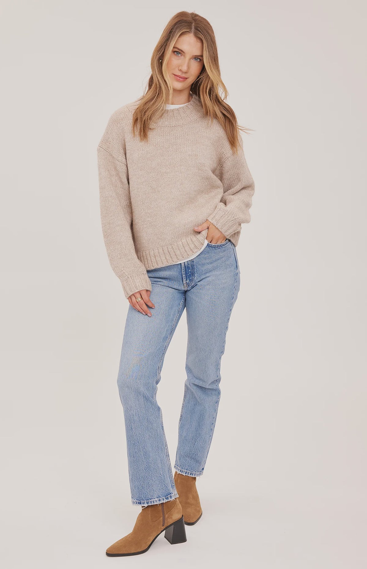 Tova sweater in a soft heathered knit with an oversized crew neckline, relaxed fit, and perfectly cropped length. Available in Heather Pebble and Heather Skyline.