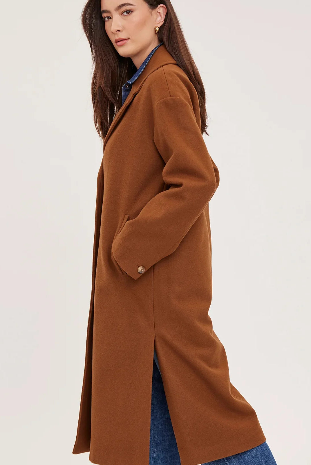 Agatha coat in soft, brushed melton fabric, featuring a front button closure, welt pockets, side slits, and a fully lined interior.