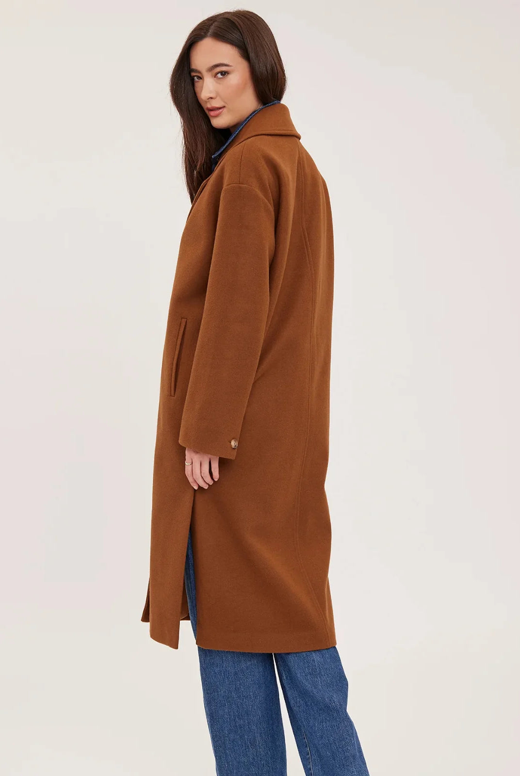 Agatha coat in soft, brushed melton fabric, featuring a front button closure, welt pockets, side slits, and a fully lined interior.