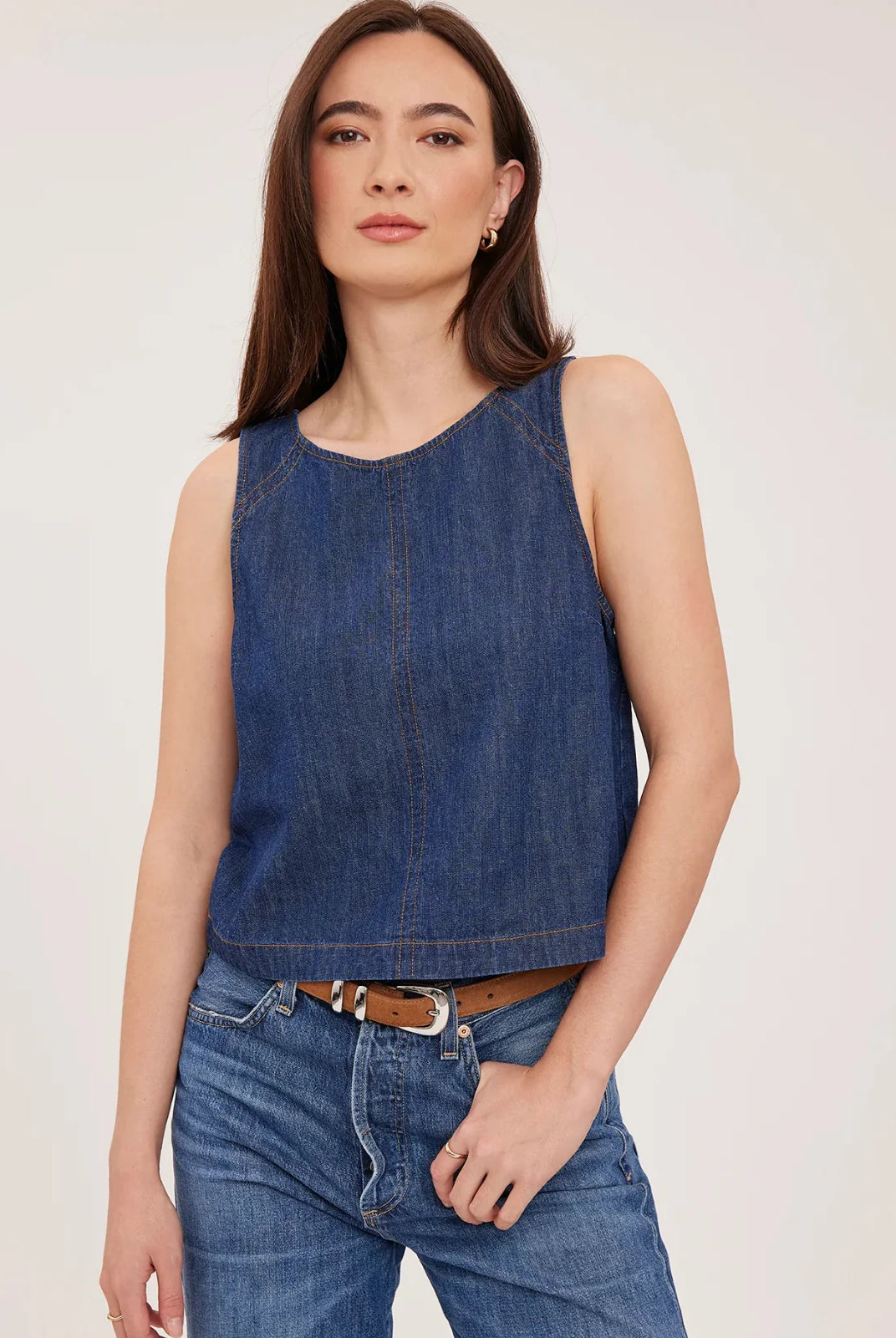 Blaise denim tank top in washed denim with contrast topstitching details and a back keyhole closure, designed for a relaxed, lived-in look.