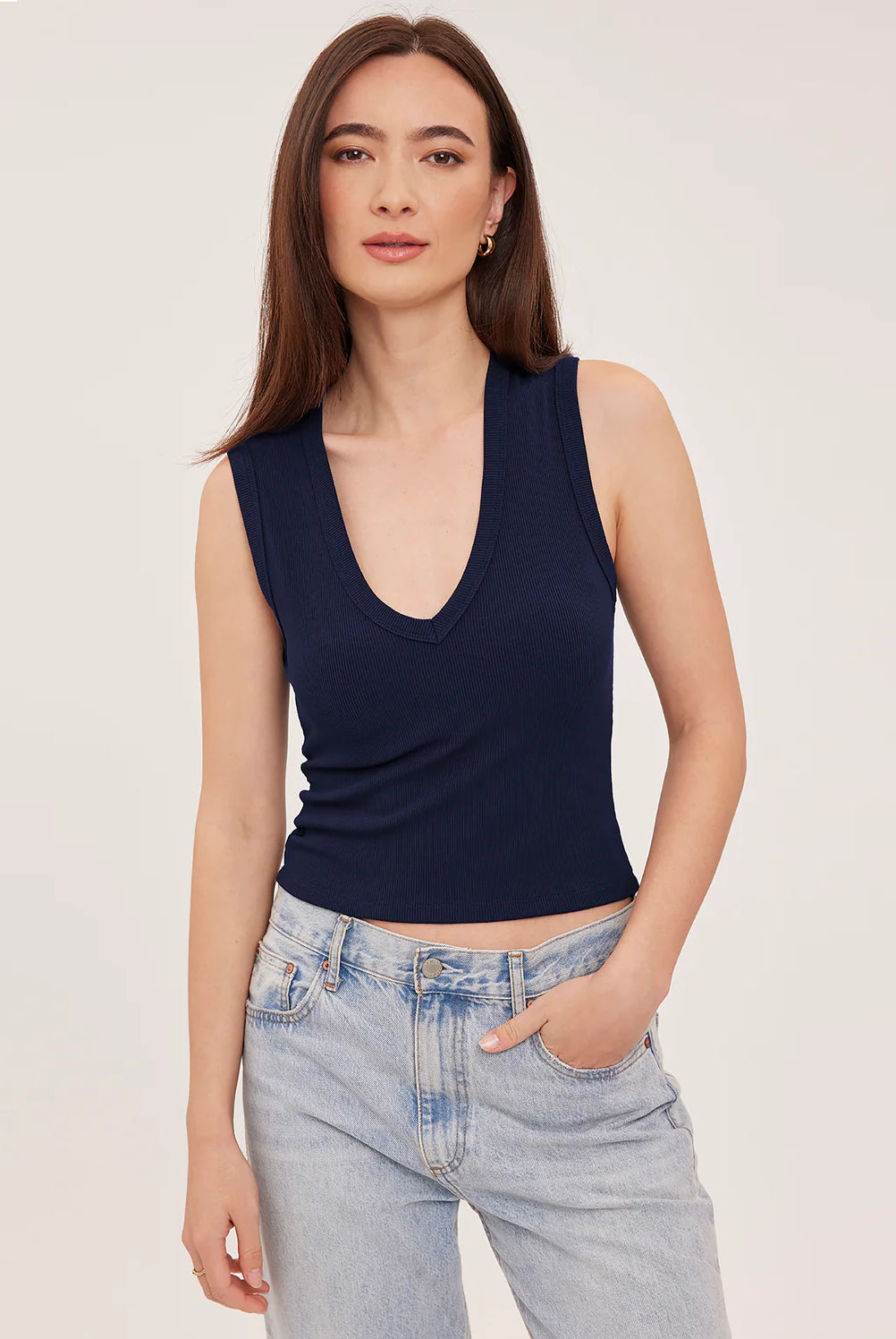 Women's navy blue ribbed cropped tank top featuring a V-neckline, wide straps, and a fitted cropped silhouette in a comfortable stretch ribbed knit.