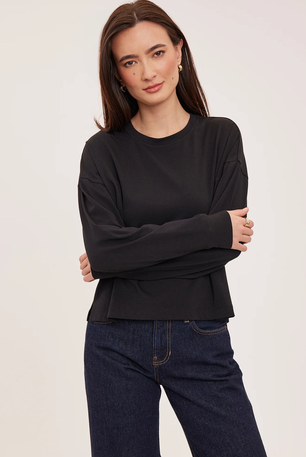 Easton top in a soft cotton-modal blend with a classic crew neckline, oversized fit, and side slit details for added movement. Available in Black and Cream.