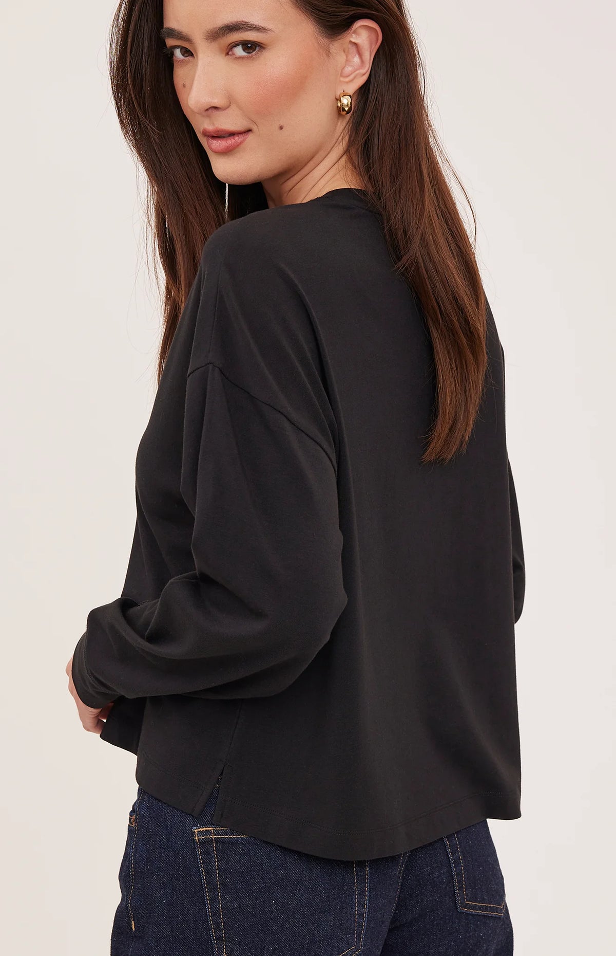 Easton top in a soft cotton-modal blend with a classic crew neckline, oversized fit, and side slit details for added movement. Available in Black and Cream.