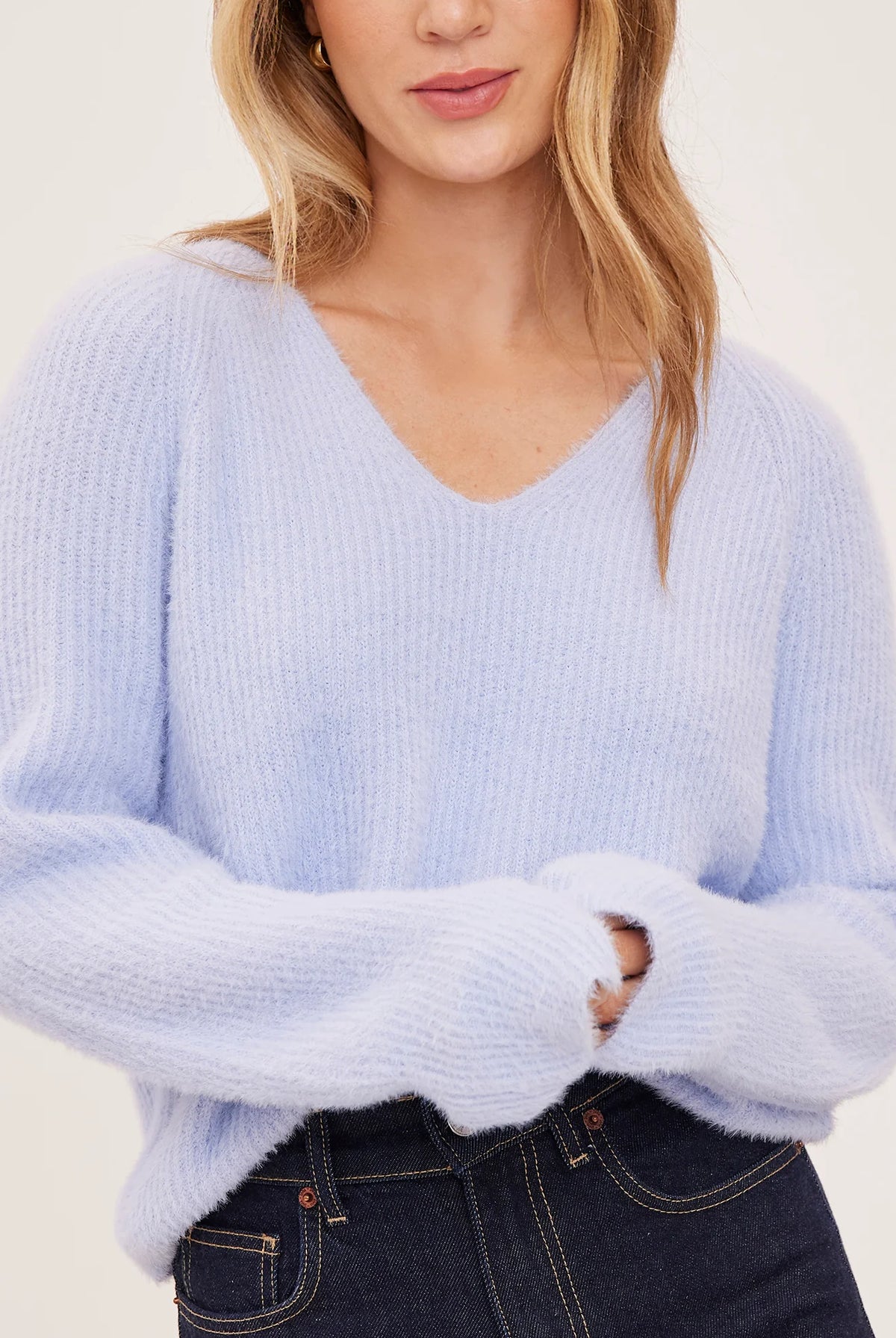 Filomena sweater in a soft, plush knit with a relaxed silhouette, flattering V-neckline, and raglan sleeves for an easy, laid-back fit. Available in Smoke and Skyline.