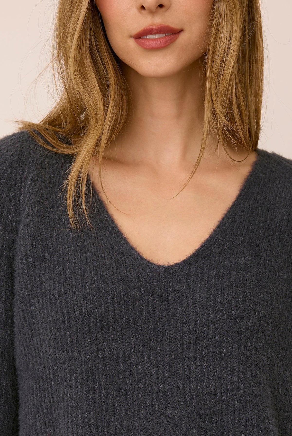 Filomena sweater in a soft, plush knit with a relaxed silhouette, flattering V-neckline, and raglan sleeves for an easy, laid-back fit. Available in Smoke and Skyline.