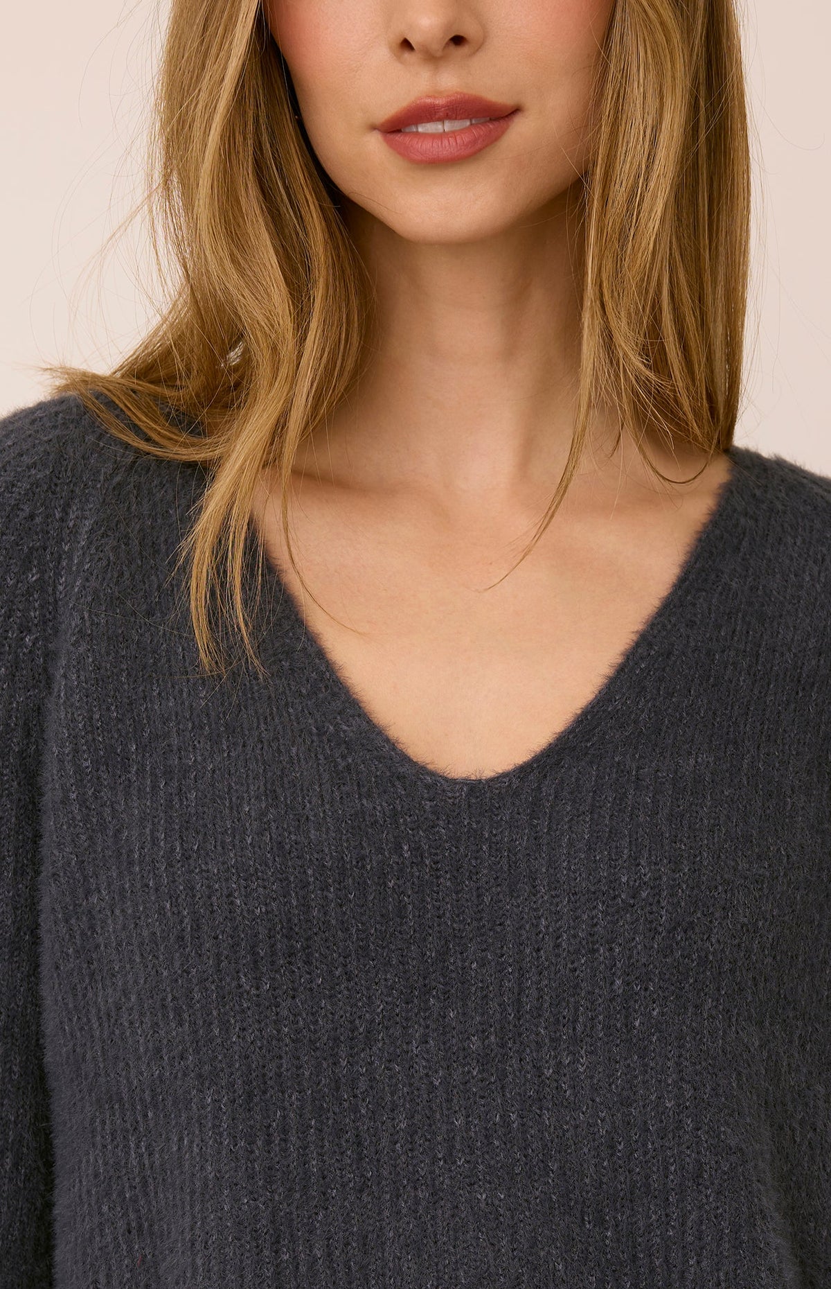 Filomena sweater in a soft, plush knit with a relaxed silhouette, flattering V-neckline, and raglan sleeves for an easy, laid-back fit. Available in Smoke and Skyline.