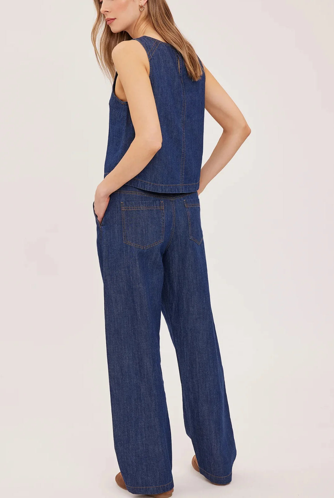 Hayden high-rise barrel-leg pants in washed denim, featuring slash pockets, a front zipper closure, and an elasticated back waistband. Made from a cotton-linen blend for a relaxed, lived-in look.