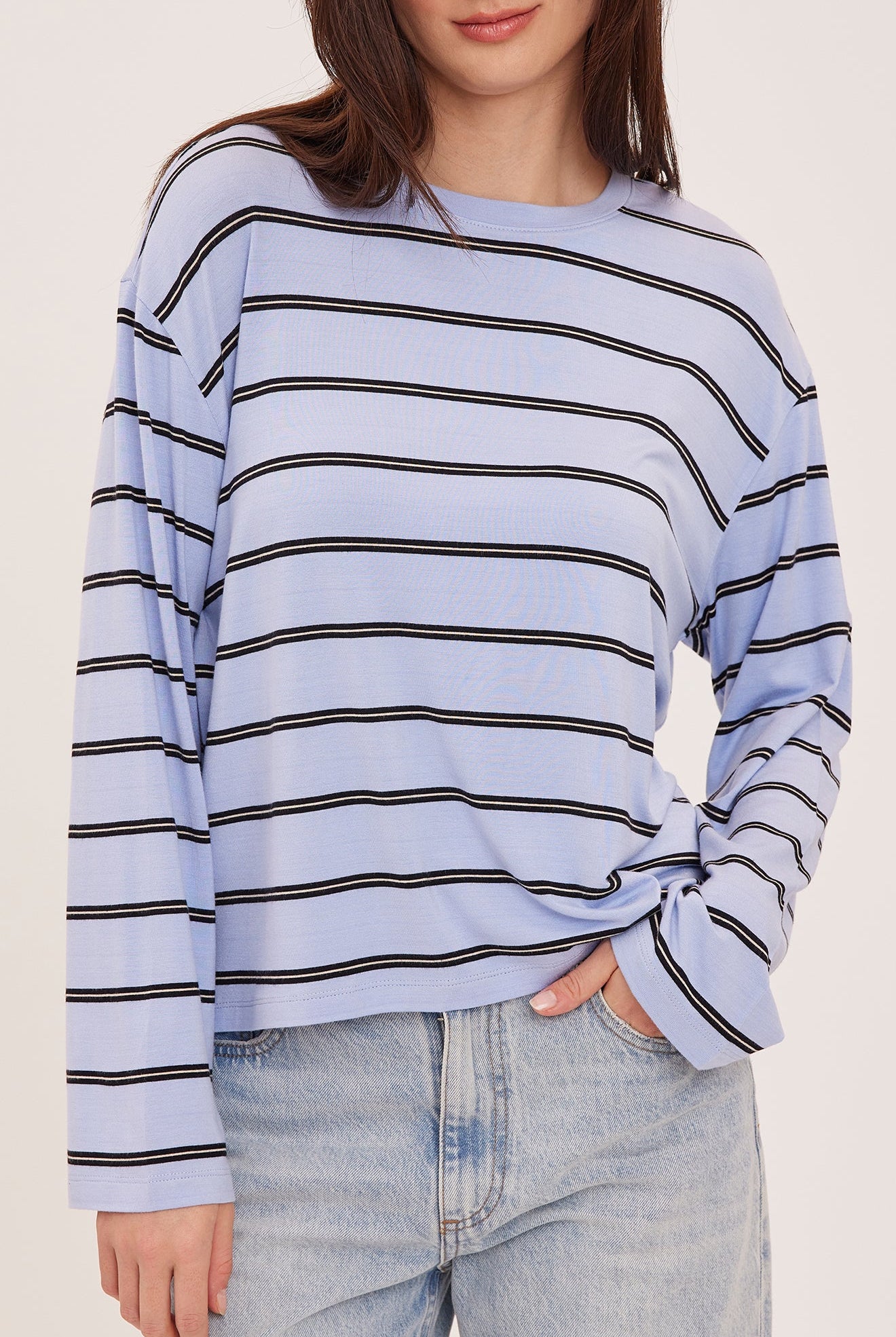 Women's relaxed long sleeve top with sky blue and white stripes, a crew neckline, side slits, and a soft rayon jersey fabric