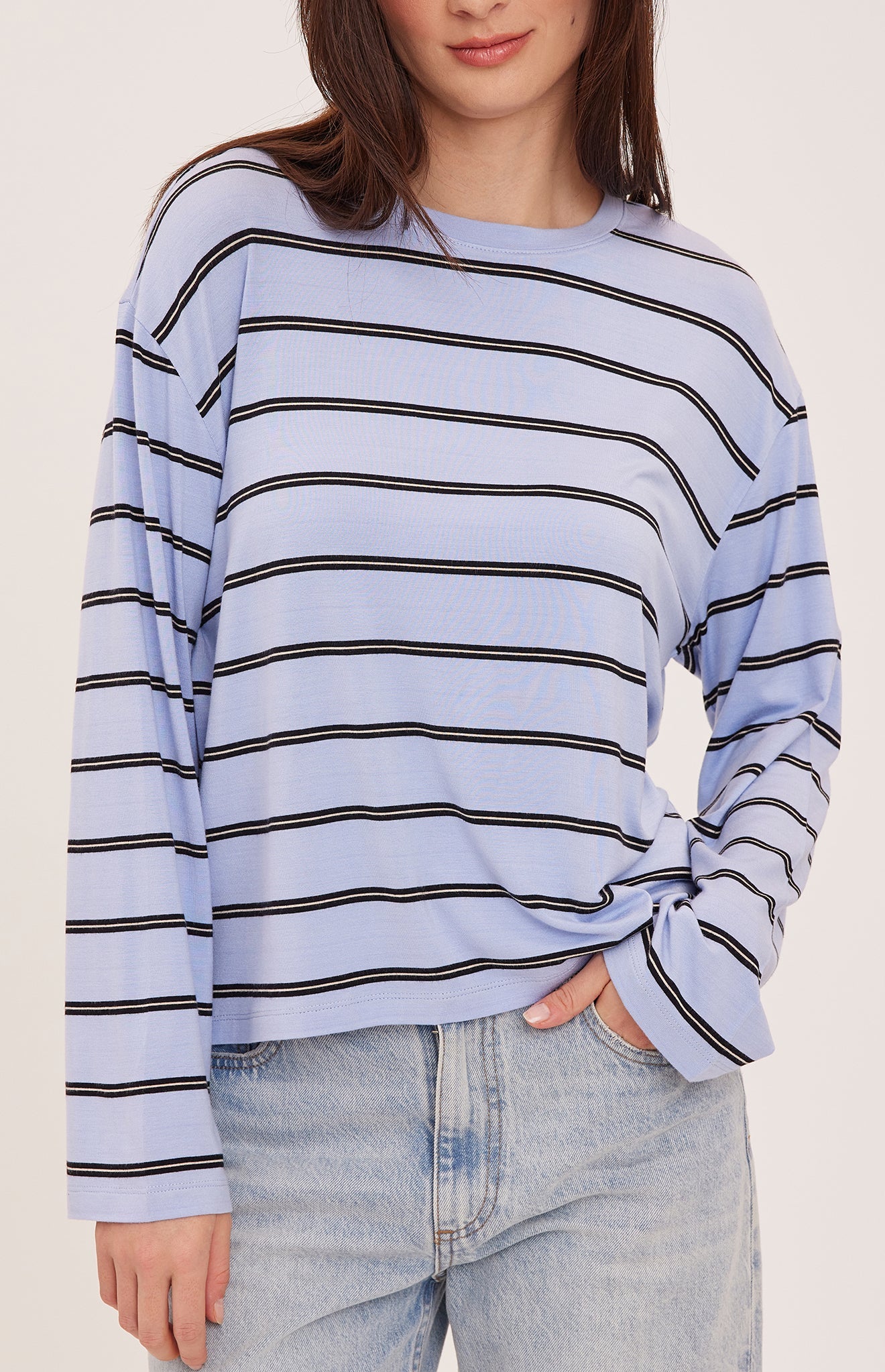 Women's relaxed long sleeve top with sky blue and white stripes, a crew neckline, side slits, and a soft rayon jersey fabric