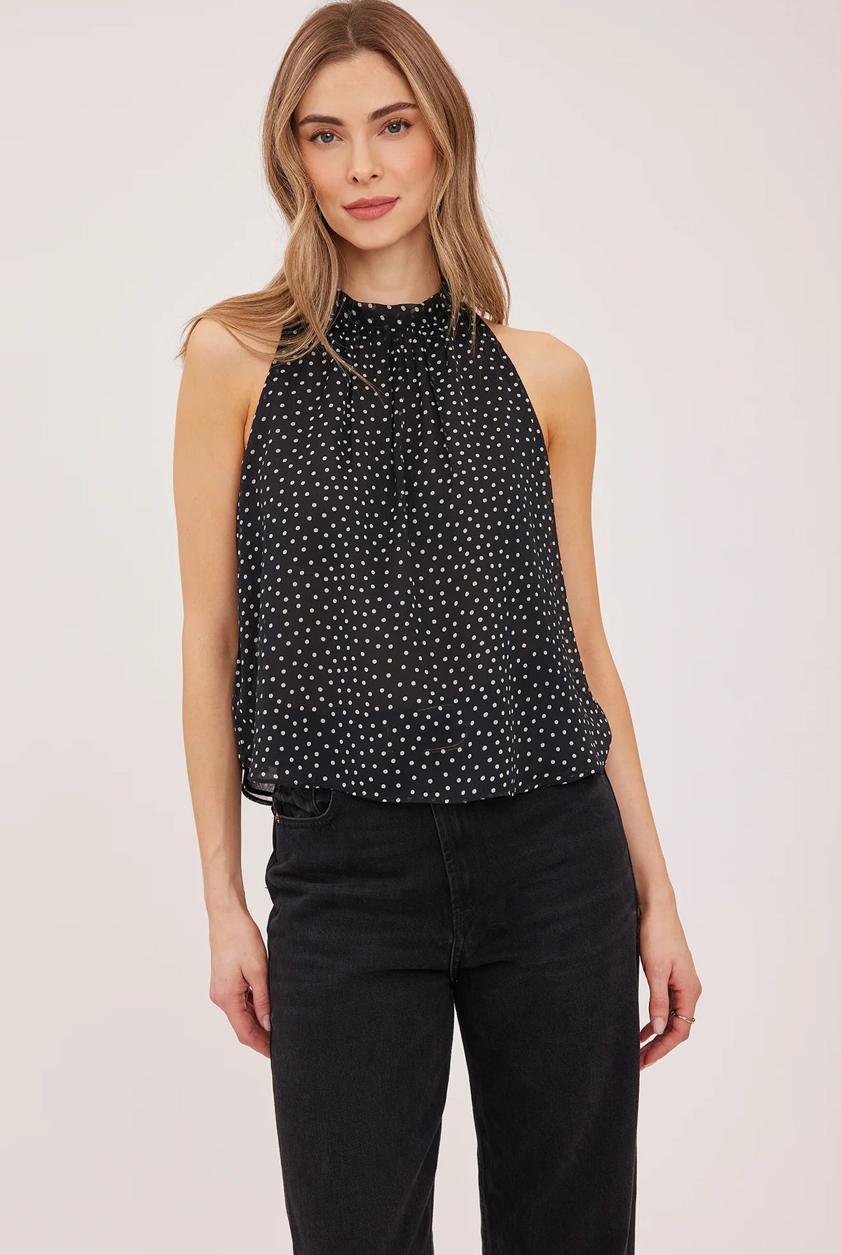 Lenora blouse in crinkled chiffon with a mock neckline, long sleeves, and a feminine back tie detail. Fully lined for comfortable wear and available in Black Print and Cream Print.