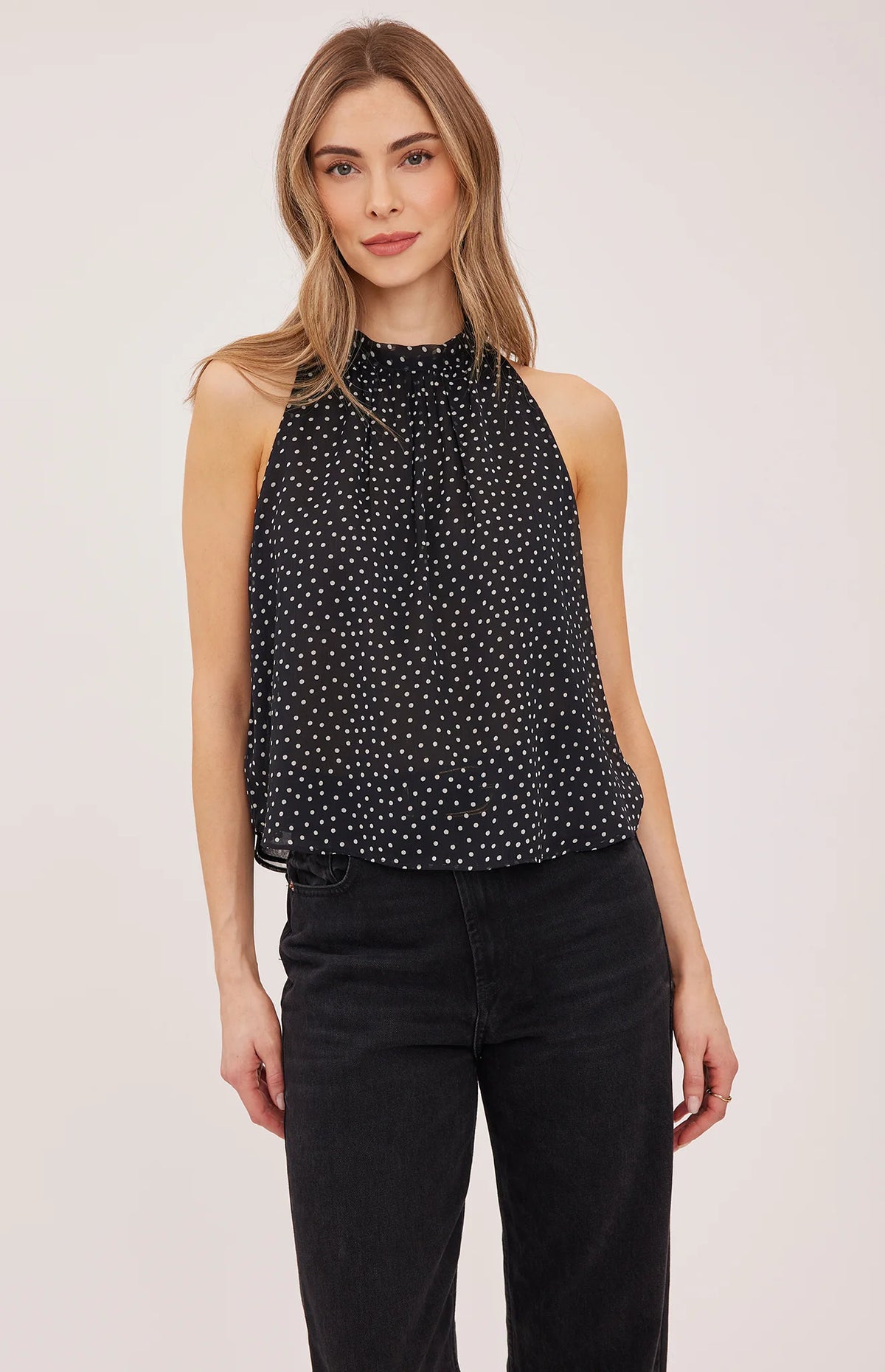 Lenora blouse in crinkled chiffon with a mock neckline, long sleeves, and a feminine back tie detail. Fully lined for comfortable wear and available in Black Print and Cream Print.
