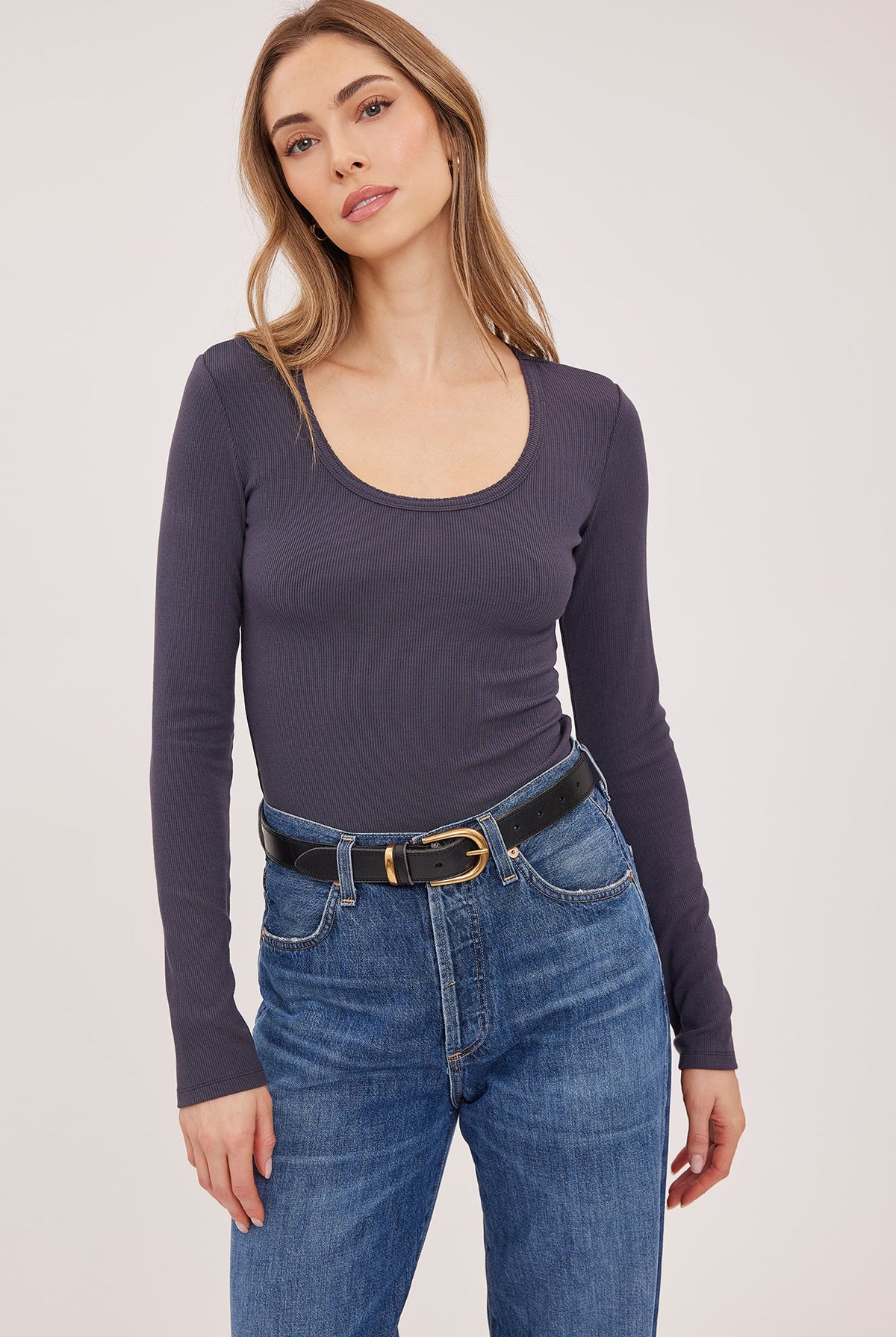Lexy top in a stretchy ribbed fabric with a body-hugging contour fit, scoop neckline, and delicate scalloped edge for a feminine finish. Available in Black and Smoke.