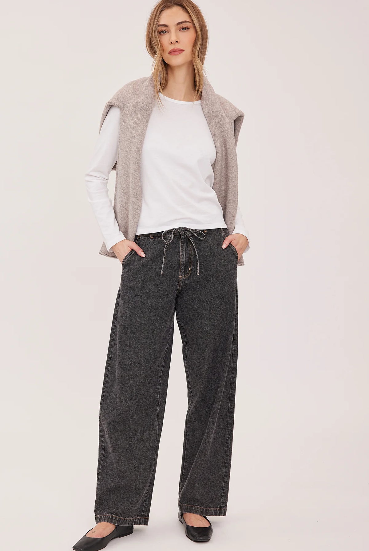 Hayden high-rise barrel-leg pants in washed denim, featuring slash pockets, a front zipper closure, and an elasticated back waistband. Made from a cotton-linen blend for a relaxed, lived-in look.