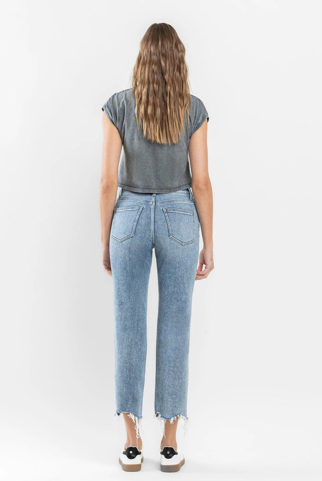 Flying Monkey High Rise Cropped Distress Hem- Ergonomical. The Ergonomical straight jeans provide comfort and a great fit. They feature a high-rise waist and are made of stretch denim for extra comfort. A distressed hem and cropped length complete the look.
