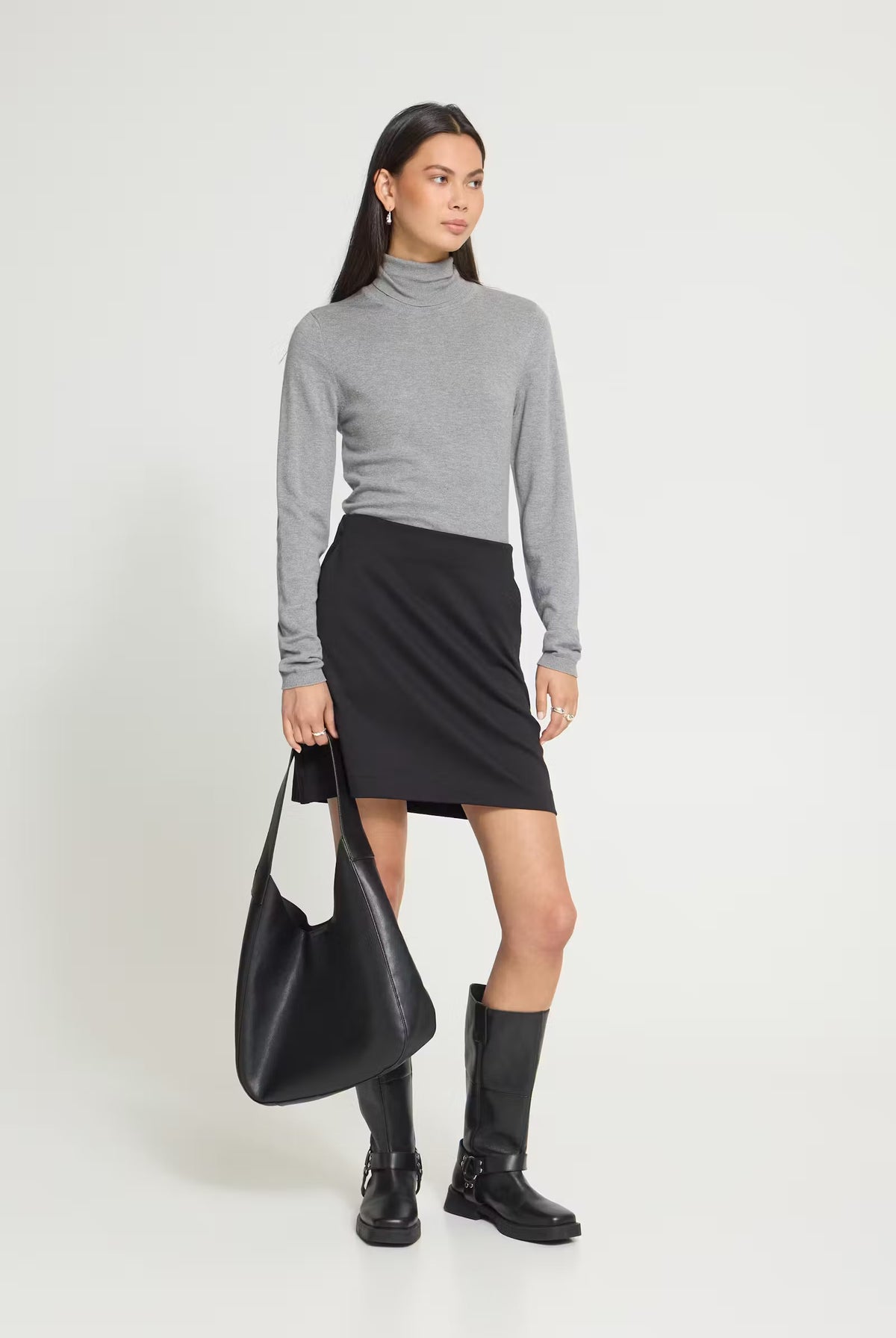 Mini skirt featuring a fitted waist, clean straight silhouette, and smooth soft-touch finish.