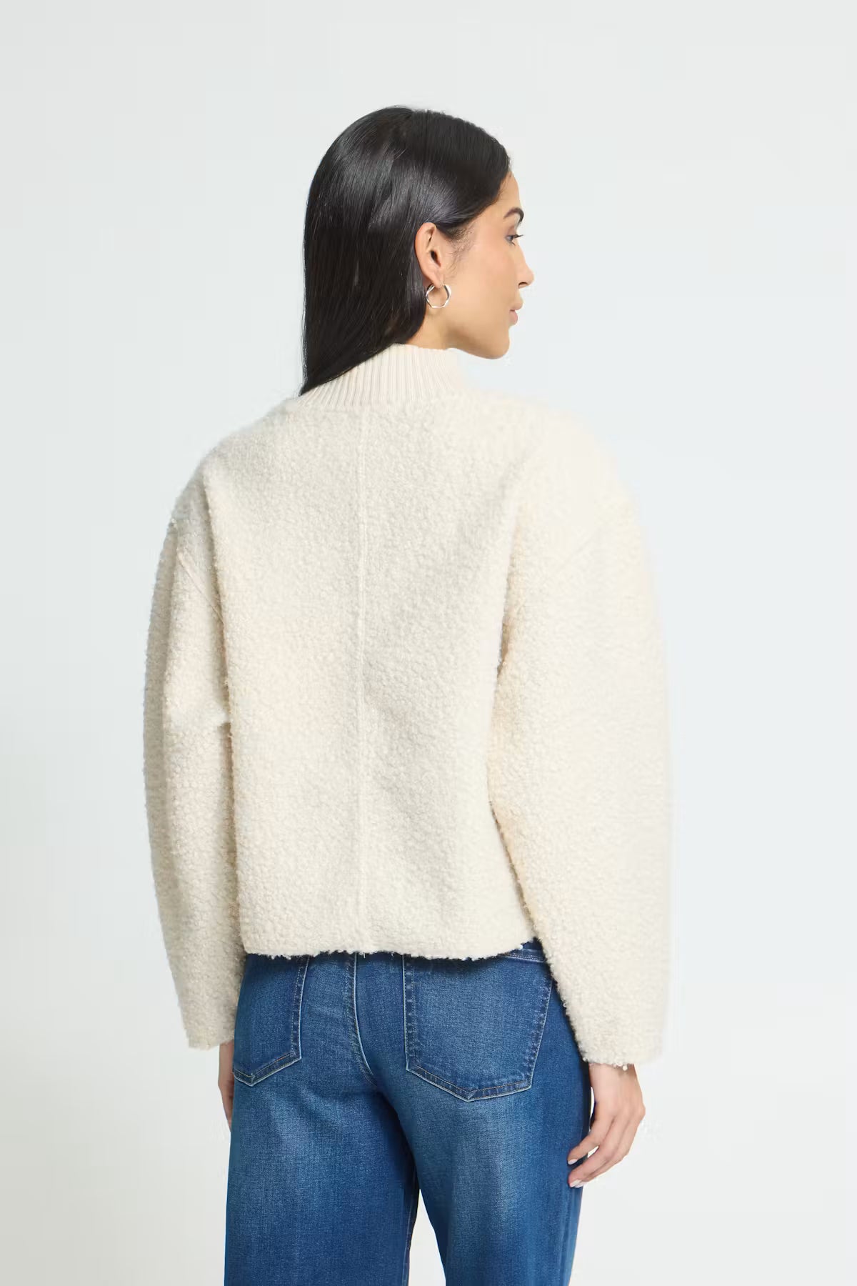 Teddy textured pullover with a soft, cozy finish, relaxed straight silhouette, ribbed mock neckline, and long sleeves for an easy everyday look.