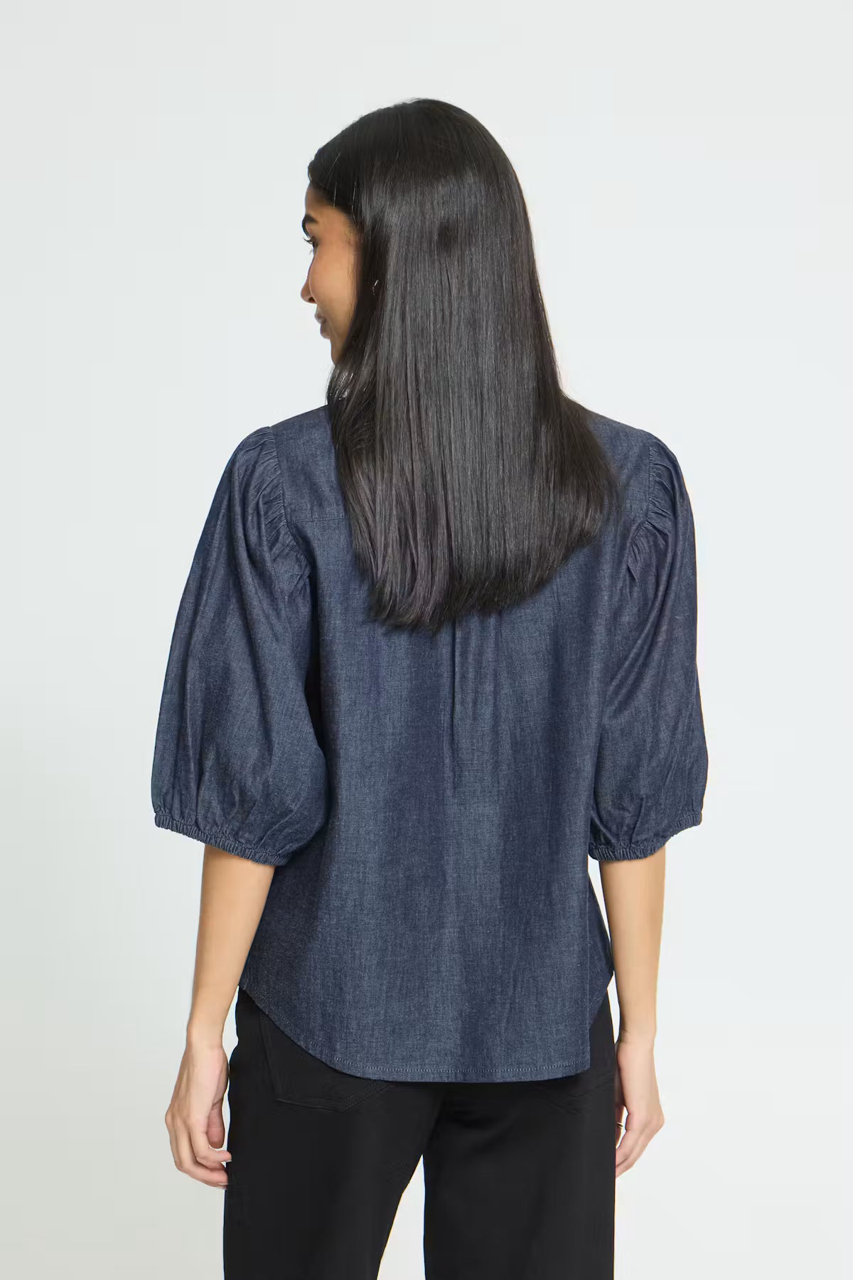 Washed dark blue cotton shirt featuring a straight silhouette, voluminous elbow-length sleeves, classic collar, concealed front button placket, and a soft textured finish for a relaxed yet polished look.