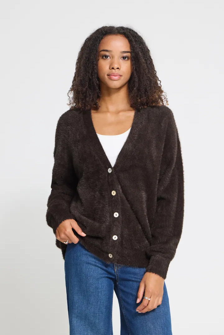 Knit cardigan in a light Cloud Dancer shade featuring a relaxed fit, long sleeves, and a button-front closure with a cozy textured finish.