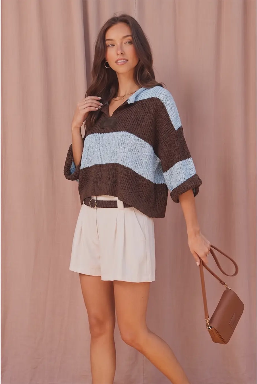 Women’s striped chunky knit sweater featuring a collared V-neckline, relaxed fit, dropped shoulders, and short wide sleeves.