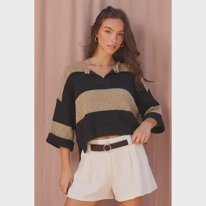Women’s striped chunky knit sweater featuring a collared V-neckline, relaxed fit, dropped shoulders, and short wide sleeves.