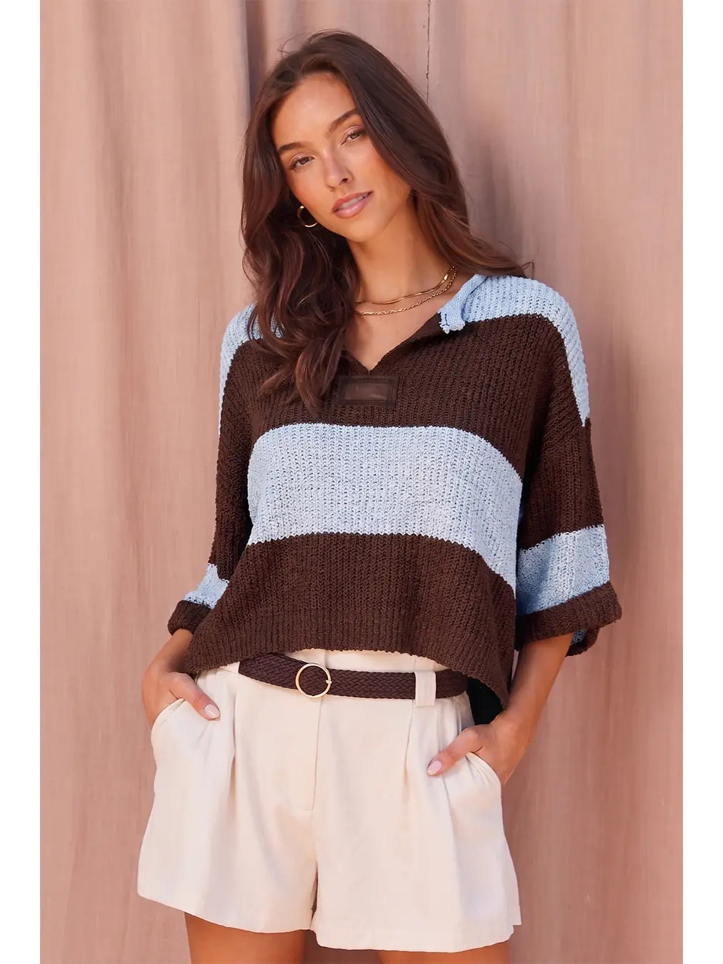 Women’s striped chunky knit sweater featuring a collared V-neckline, relaxed fit, dropped shoulders, and short wide sleeves.