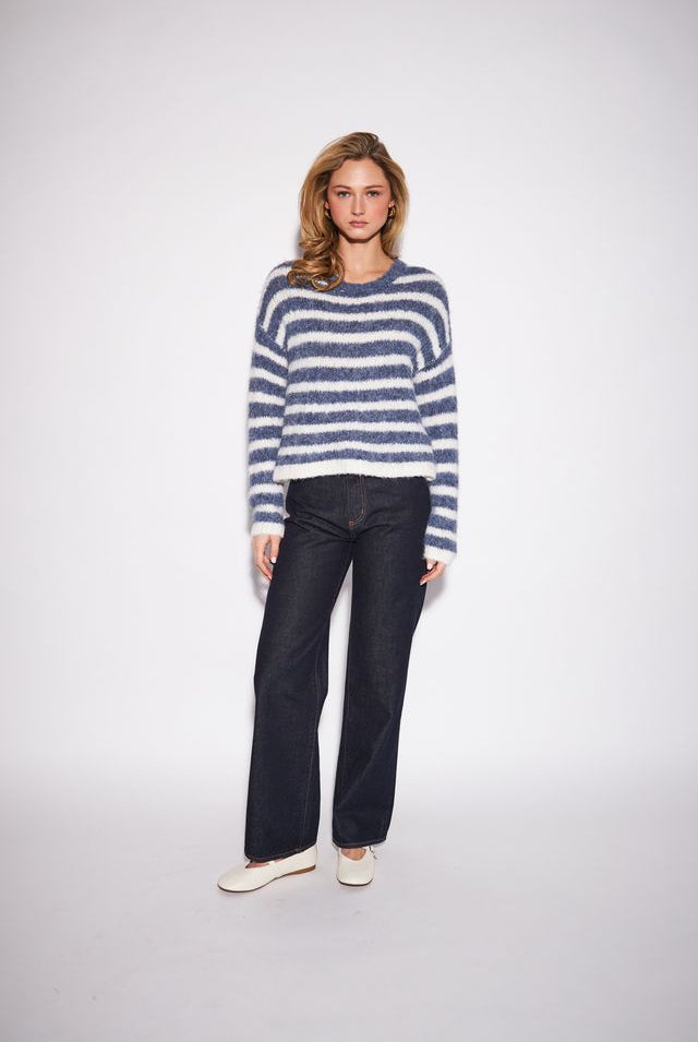 Relaxed crewneck sweater featuring bold horizontal stripes in a soft, substantial knit made from recycled polyester, nylon, wool, and spandex.