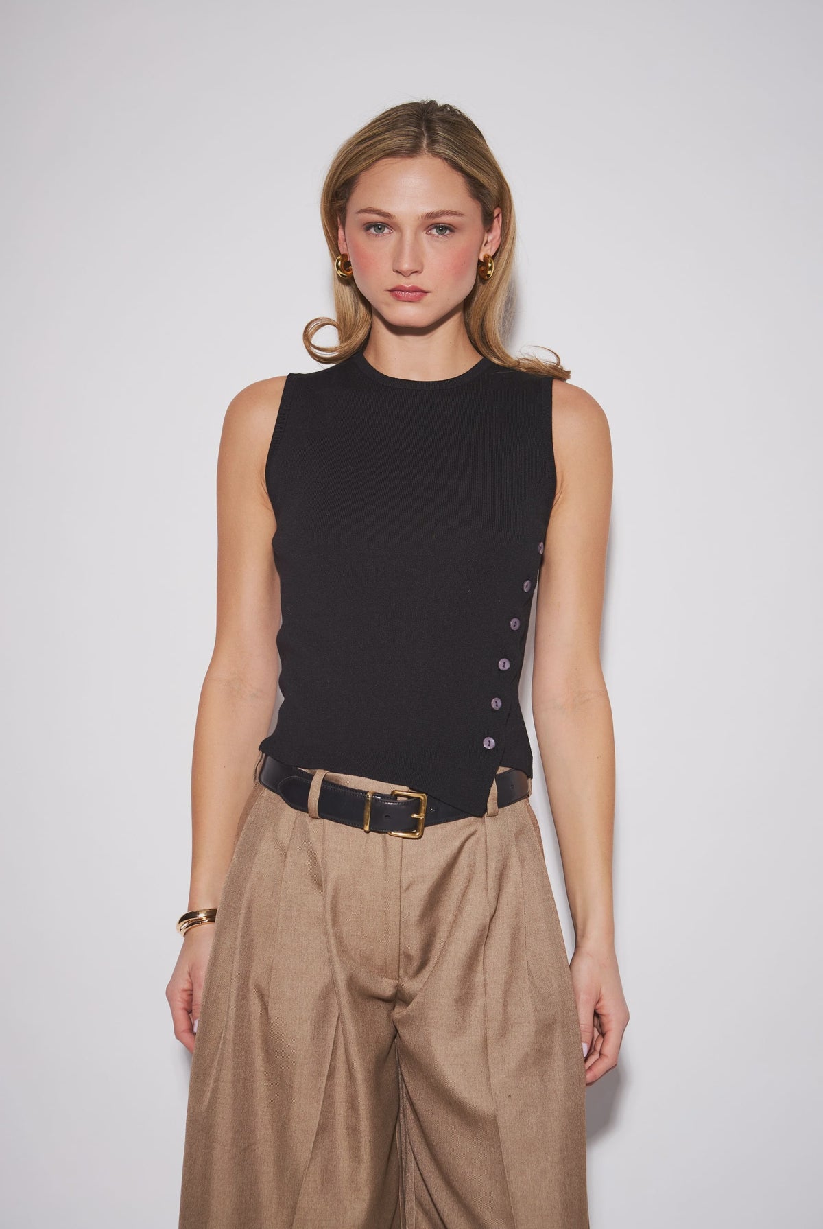 Nellie Top featuring a sleek sleeveless knit design with a clean, close-to-the-body silhouette, perfect for wearing alone or layering.
