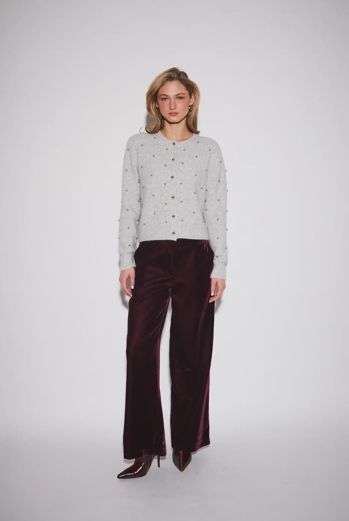 John & Jenn Sullivan Cardigan in Silver Bells featuring a classic crew neckline, button-front closure, long sleeves, and silver ball stud detailing throughout for a chic, polished look.