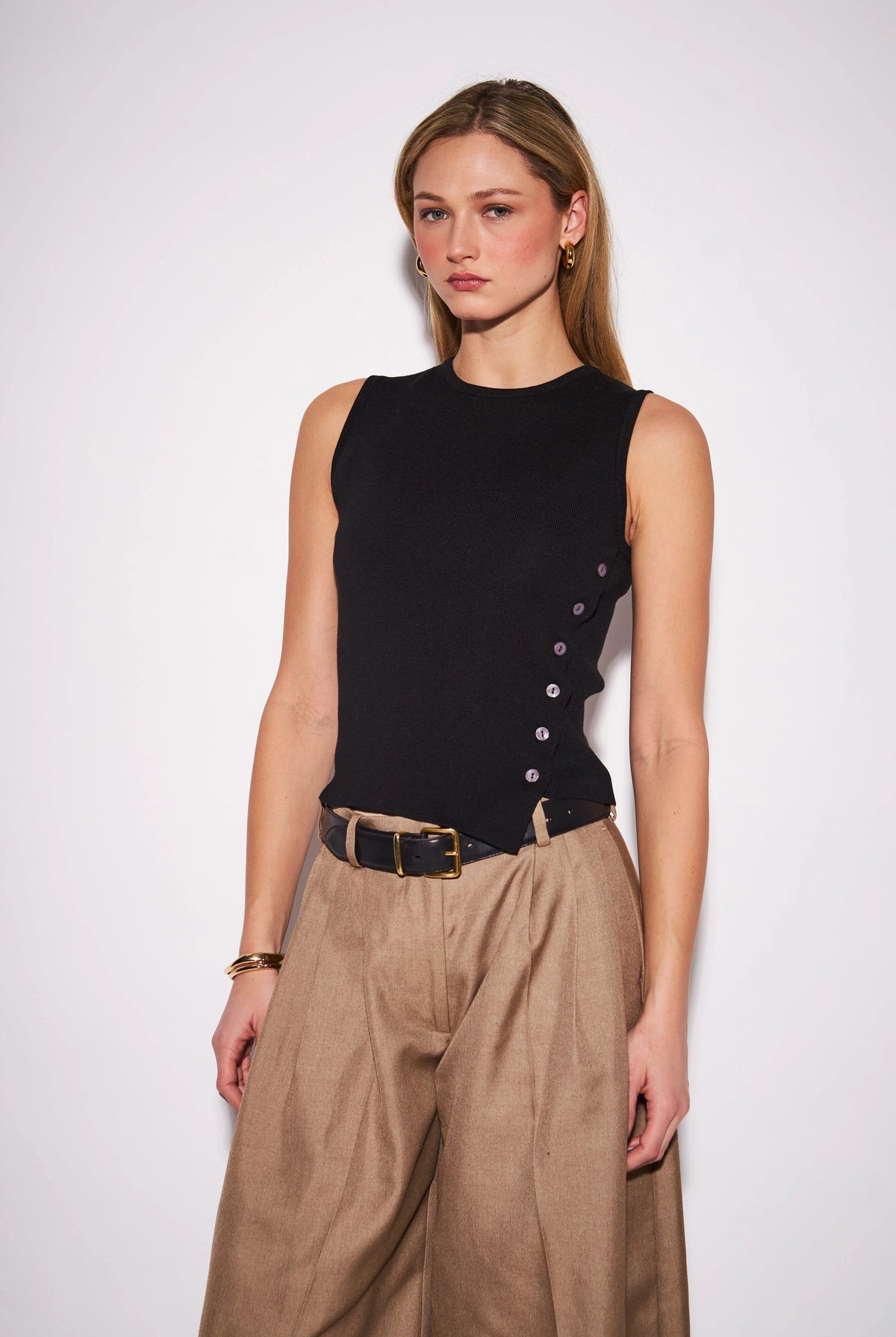 Nellie Top featuring a sleek sleeveless knit design with a clean, close-to-the-body silhouette, perfect for wearing alone or layering.