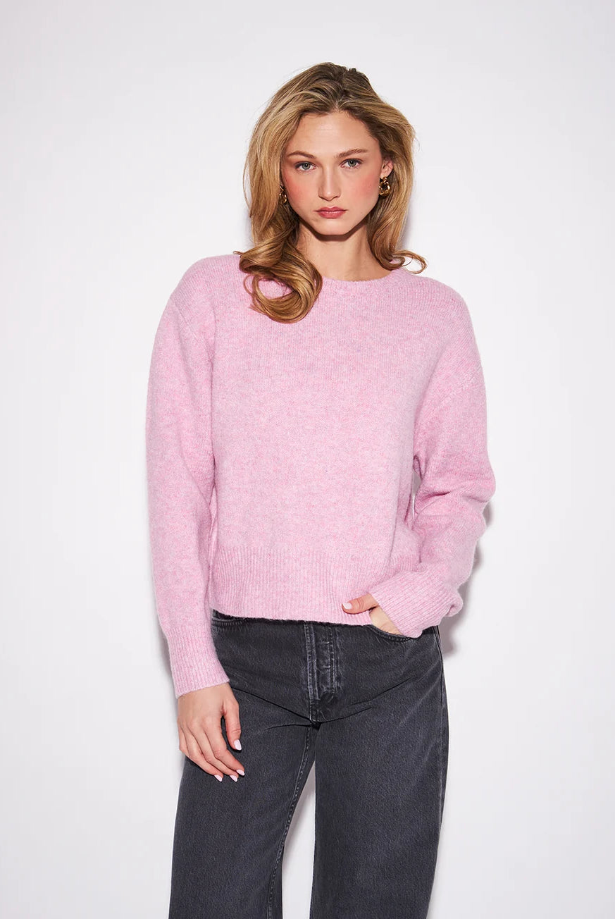 Relaxed-fit crewneck sweater in a soft knit fabric, featuring long sleeves, ribbed cuffs and hem, and a slightly cropped length