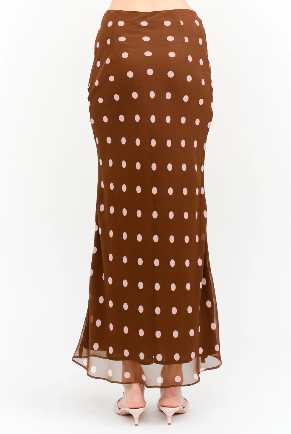 Kalila Midi Skirt in rich brown featuring soft pink polka dots, a flattering mermaid silhouette, and a flowing ankle-grazing hem.