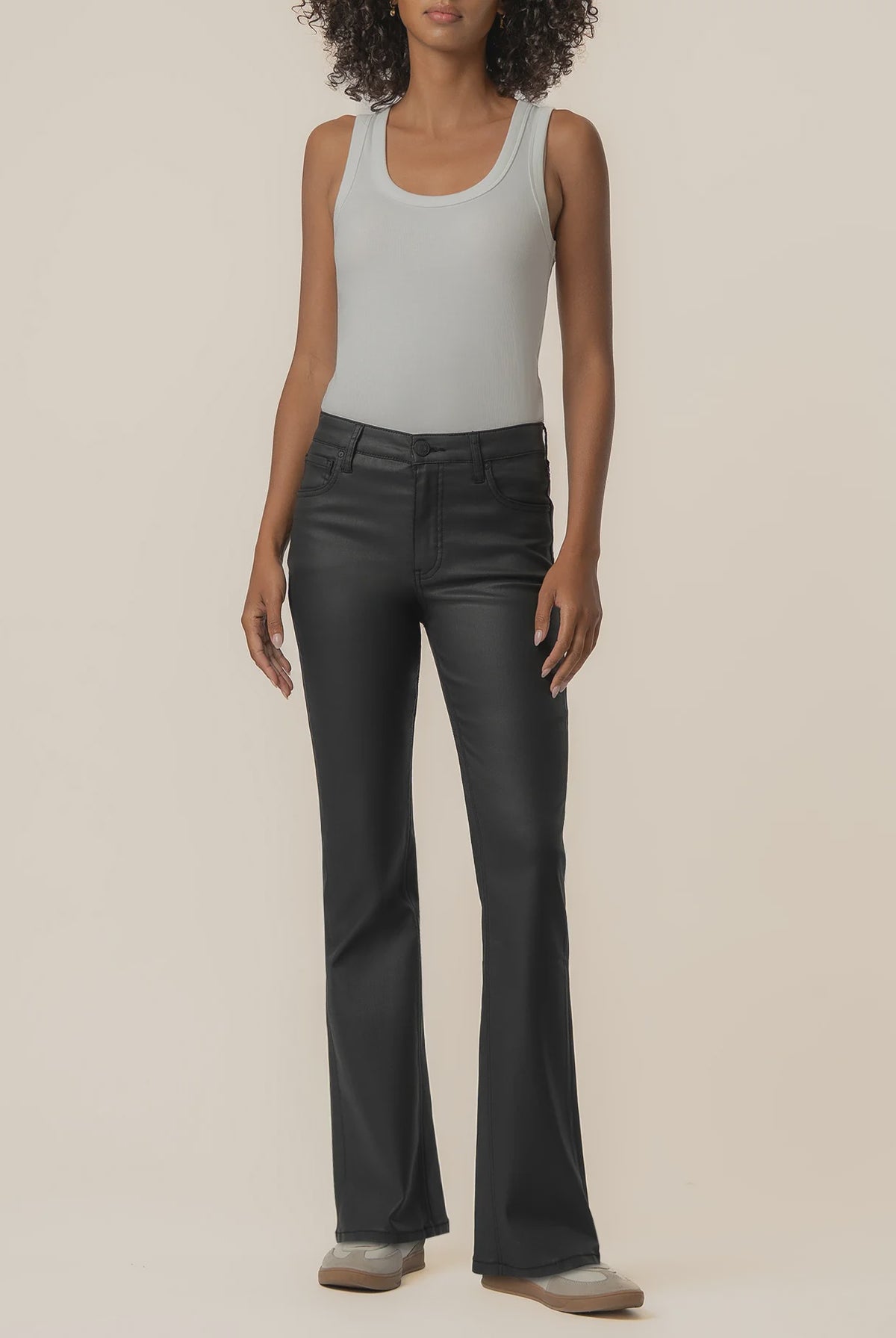 High-rise kick flare pants in Matte Black featuring a sleek coated finish, Fab Ab front pockets, inset leg detailing, and a flattering flared silhouette.