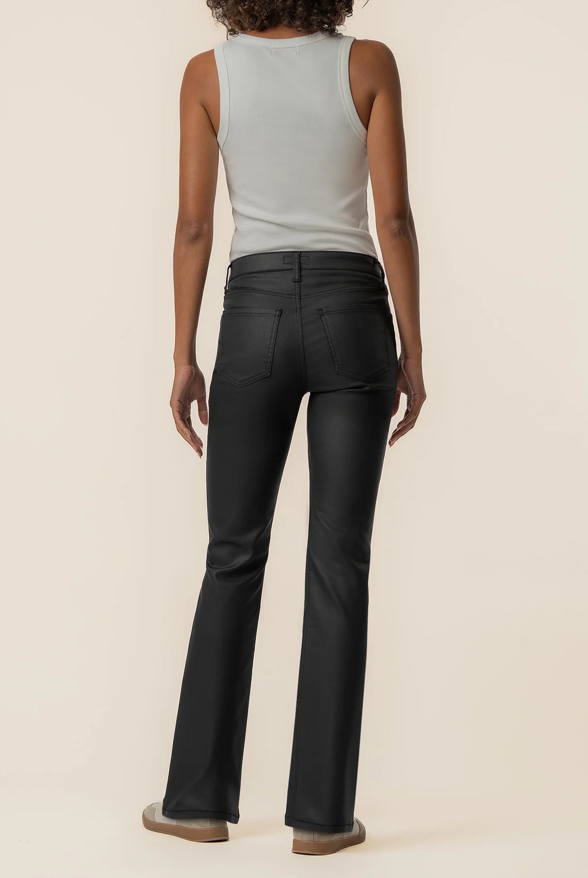 High-rise kick flare pants in Matte Black featuring a sleek coated finish, Fab Ab front pockets, inset leg detailing, and a flattering flared silhouette.