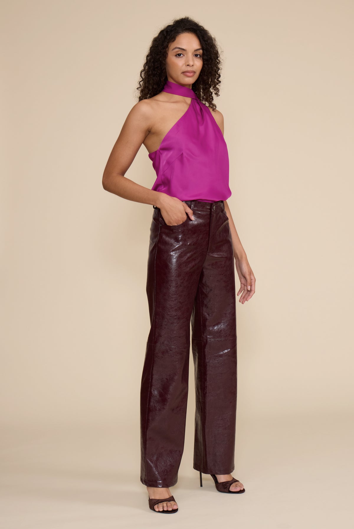 Cleo Faux Leather Pant in wine featuring a high-rise waist, straight-leg fit, and glossy faux leather finish.