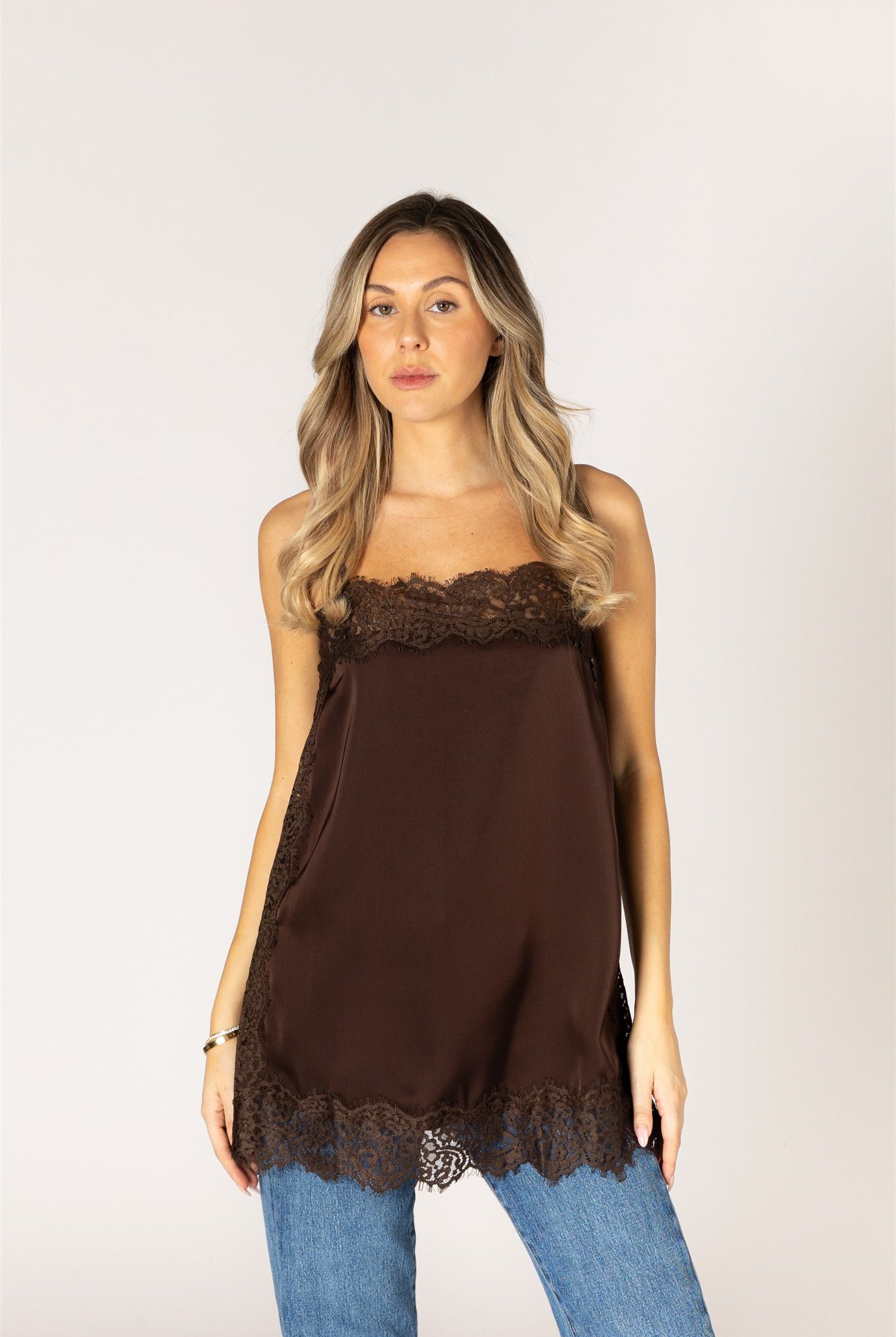Chocolate brown lace trim camisole top with delicate lace detailing at the neckline and hem.