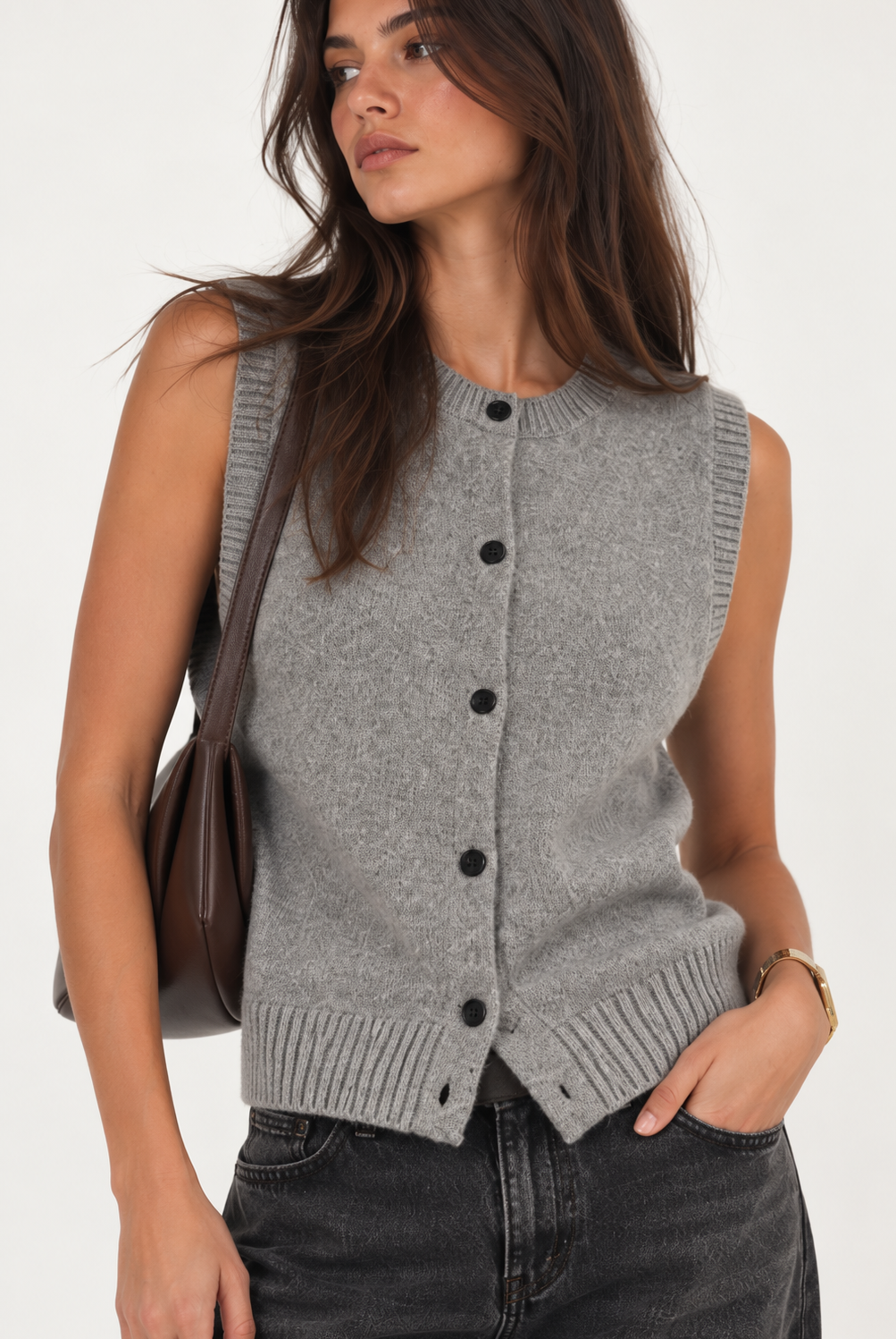 Heather grey knit vest with a sleeveless silhouette, round neckline, contrast button-front closure, and ribbed trim along the neckline, armholes, and hem. Designed with a clean, versatile fit for easy layering.