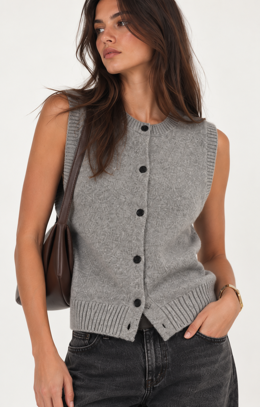 Heather grey knit vest with a sleeveless silhouette, round neckline, contrast button-front closure, and ribbed trim along the neckline, armholes, and hem. Designed with a clean, versatile fit for easy layering.