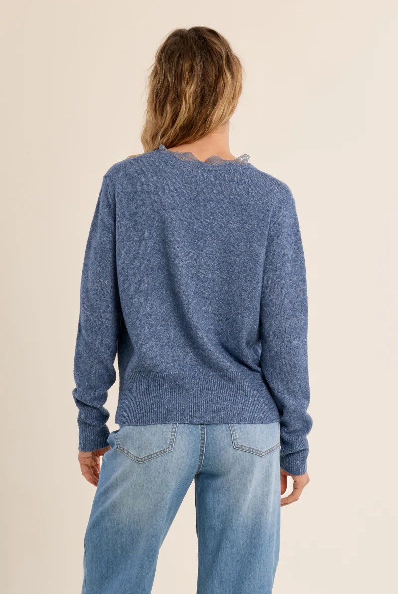 Short knit cardigan featuring long sleeves, a lace-trimmed V-neckline, and a full-length front button closure.