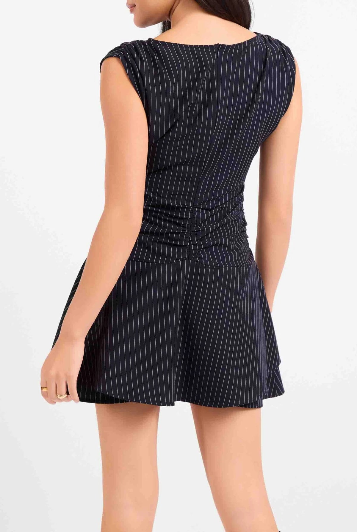 Mini dress featuring a relaxed yet structured silhouette with classic tailored details and a flattering, versatile fit.