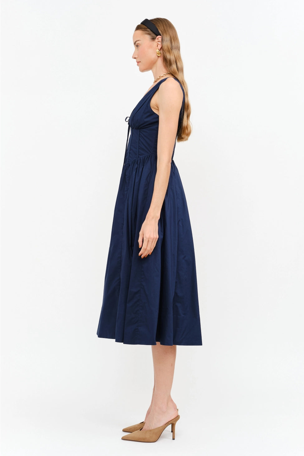 Shae Poplin Midi Dress in navy featuring a corset-inspired fitted bodice, plunging V-neckline, gathered bust with tie-front detail, defined waist, and full midi-length skirt.