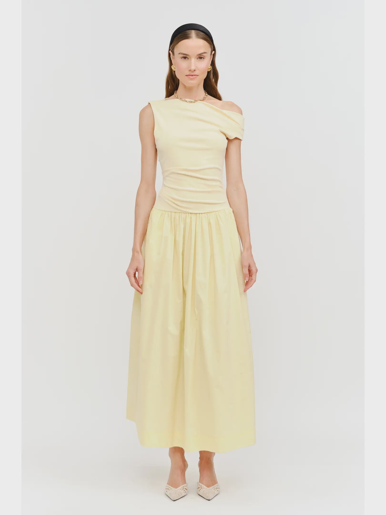 woman wearing sleeveless off the shoulder maxi butter yellow dress